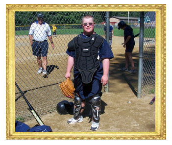 Tyler in baseball catcher's outfit