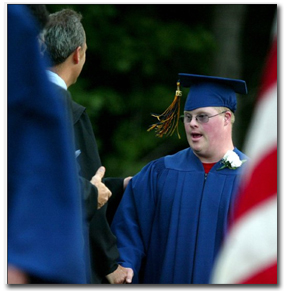 Tyler receiving diploma